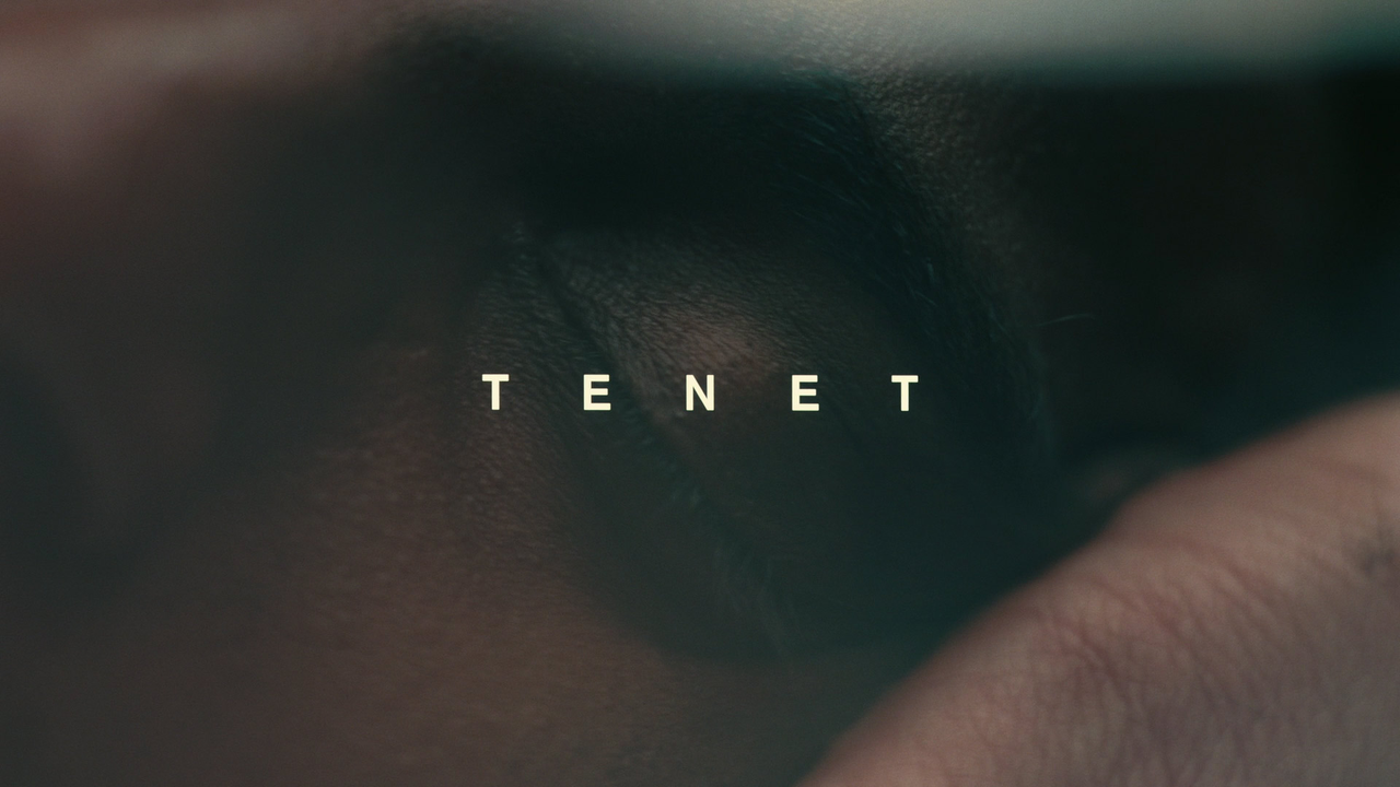 Tenet ending explained – movie poster-style image featuring the Tenet title over a close-up of the Protagonist