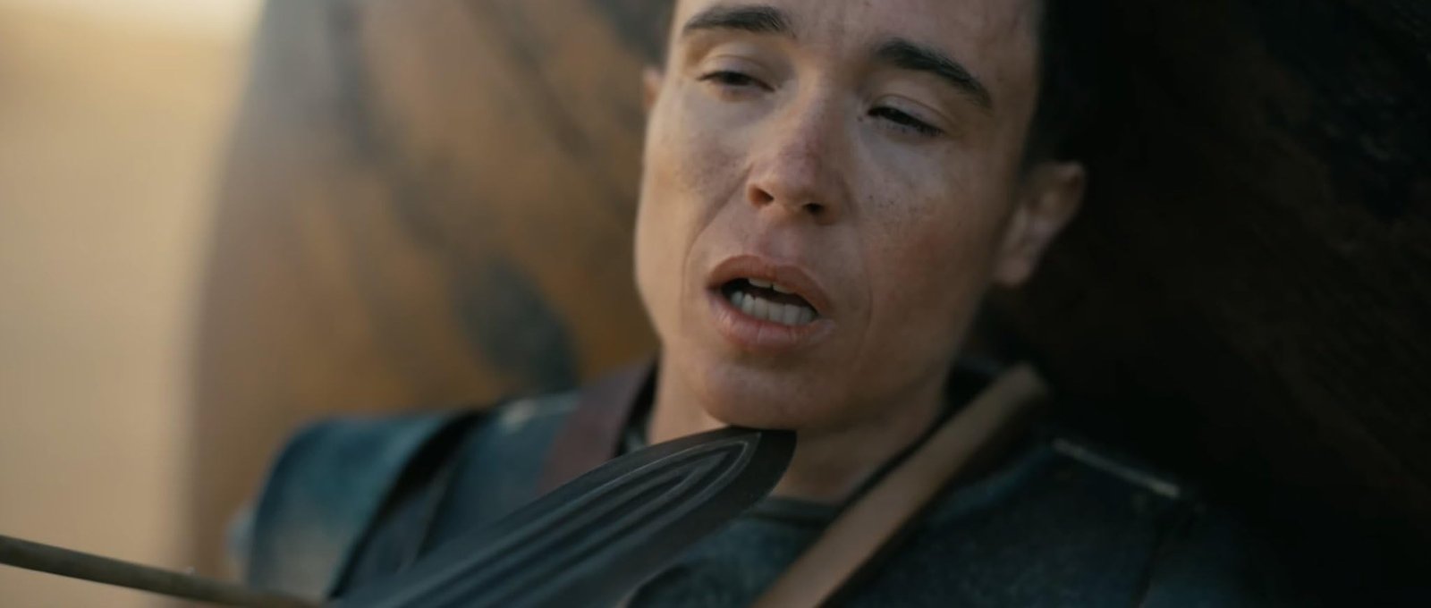 Elliot Page as Sinon held at knifepoint in Christopher Nolan’s The Odyssey (2026).